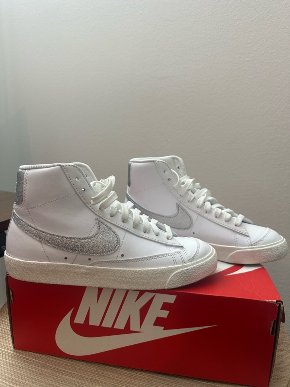 Nike White High-Top Sneakers with Silver Swoosh